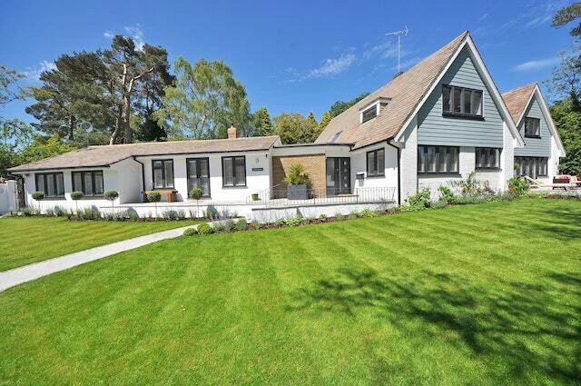 a big white house with a large lawn