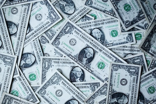 Messy pile of one dollar bills