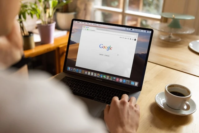Laptop open to Google search page