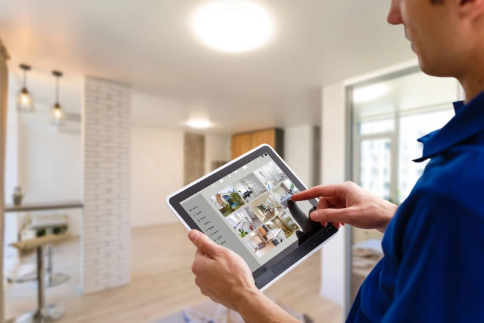 Property manager viewing smart home camera feeds on a tablet