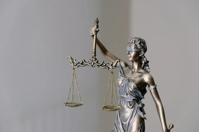 Justice figurine holding a scale
