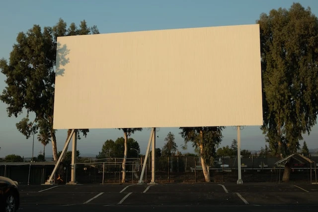 large white blank billboard in a parking lot