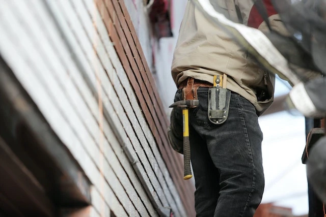 Construction workers walking up stairs