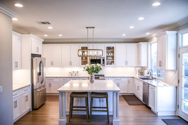 White wooden cupboards in a modern kitchen
