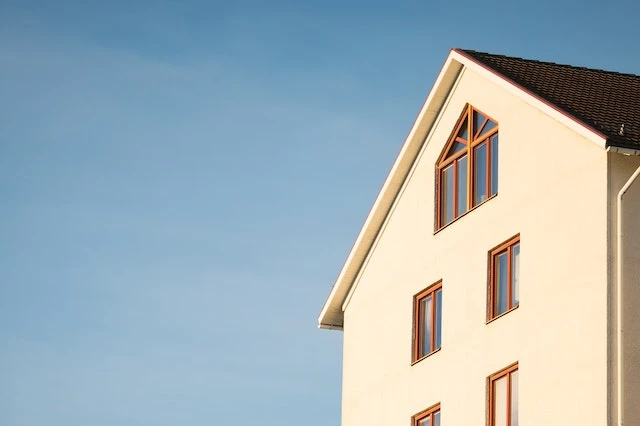 Beige concrete house against a blue sky