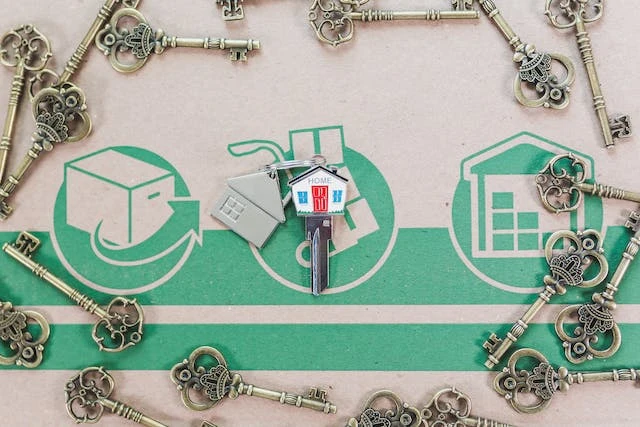 Moving box with old keys surrounding a new key 