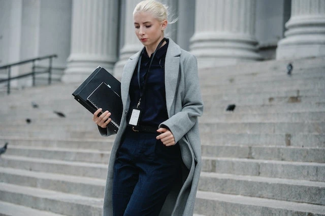 A lawyer walking down the steps of a courthouse