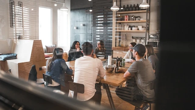 A group of people working together in an office