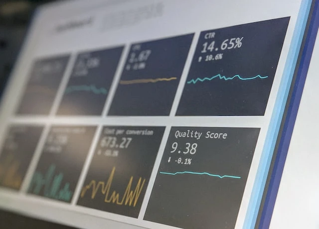 Laptop screen open to line graphs