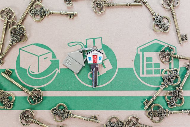 Moving box with old keys surrounding a new key