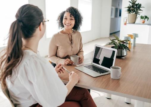 A property manager and another women sitting at a table