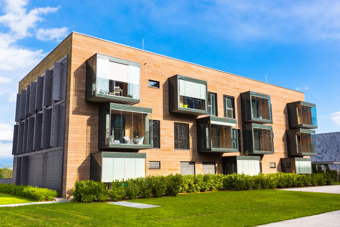 Exterior of a modern apartment building made of brick